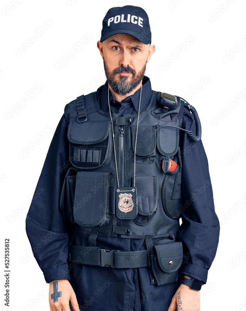 Young handsome man wearing police uniform skeptic and nervous, frowning upset because of problem. negative person. Young handsome man wearing police uniform skeptic and nervous, frowning upset because of problem. negative person.