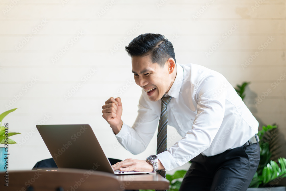 The workplace looks modern with internet work desks.Business Computer Technology Asian Men Businessman Happy Young Adult Online Office The workplace looks modern with internet work desks.Business Computer Technology Asian Men Businessman Happy Young Adult Online Office