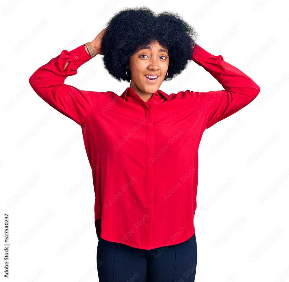 Young african american girl wearing casual clothes crazy and scared with hands on head, afraid and surprised of shock with open mouth Young african american girl wearing casual clothes crazy and scared with hands on head, afraid and surprised of shock with open mouth