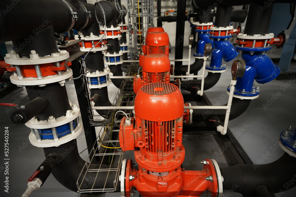 Row of heavy industry powerful liquid pumps used in refrigeration or heat pump systems