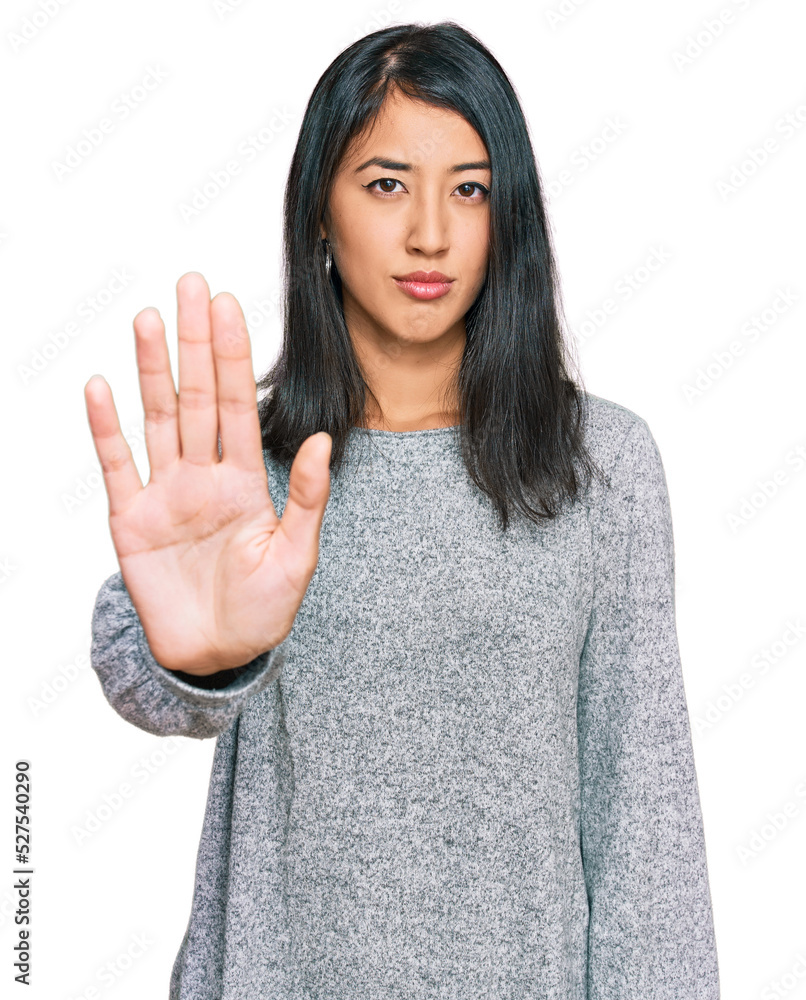 Beautiful asian young woman wearing casual clothes doing stop sing with palm of the hand. warning expression with negative and serious gesture on the face. Beautiful asian young woman wearing casual clothes doing stop sing with palm of the hand. warning expression with negative and serious gesture on the face.