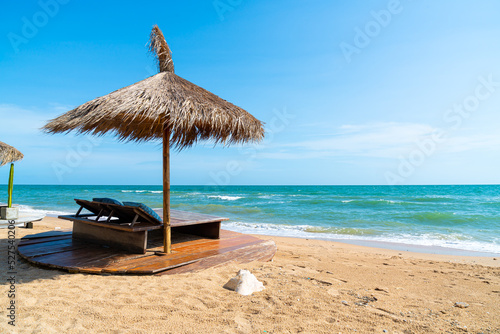beach chair and umbrella with sea beach background