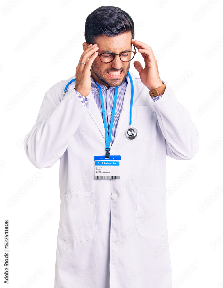 Young hispanic man wearing doctor uniform and stethoscope with hand on head, headache because stress. suffering migraine. Young hispanic man wearing doctor uniform and stethoscope with hand on head, headache because stress. suffering migraine.