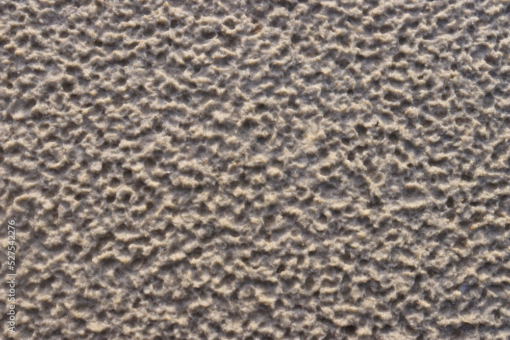 White sand with a pattern formed by rain drops White sand with a pattern formed by rain drops