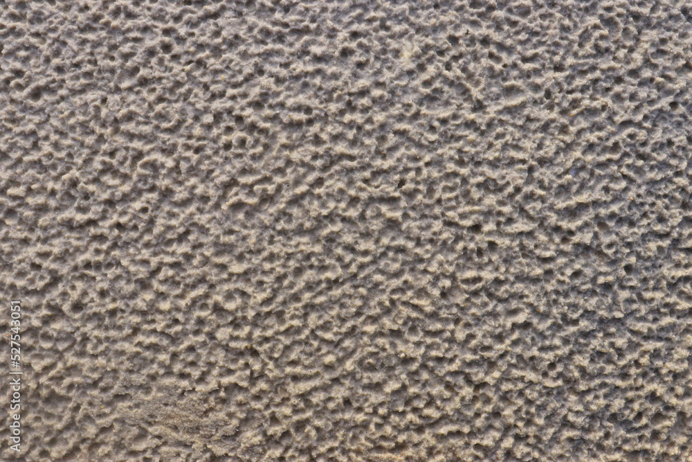 White sand with a pattern formed by rain drops White sand with a pattern formed by rain drops