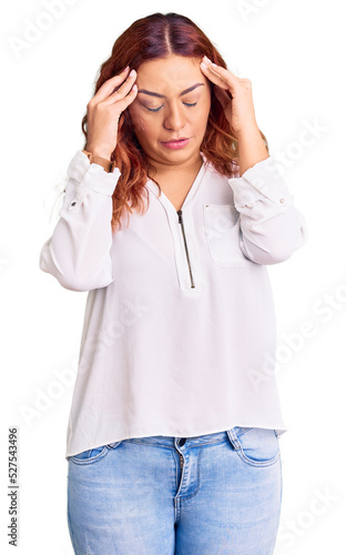 Young latin woman wearing casual clothes with hand on head for pain in head because stress. suffering migraine.