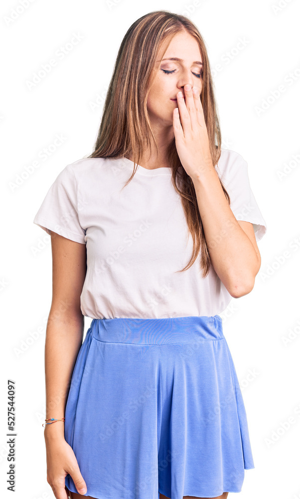 Young beautiful blonde woman wearing summer style bored yawning tired covering mouth with hand. restless and sleepiness. Young beautiful blonde woman wearing summer style bored yawning tired covering mouth with hand. restless and sleepiness.