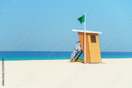 Lifeguard tower on a deserted white beach. Copy space © Sergey