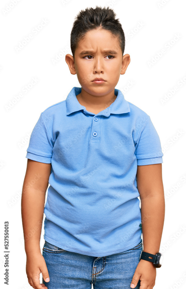 Little boy hispanic kid wearing casual clothes skeptic and nervous, frowning upset because of problem. negative person. Little boy hispanic kid wearing casual clothes skeptic and nervous, frowning upset because of problem. negative person.