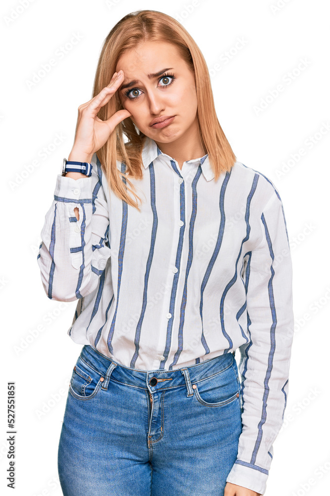 Beautiful caucasian woman wearing casual clothes worried and stressed about a problem with hand on forehead, nervous and anxious for crisis Beautiful caucasian woman wearing casual clothes worried and stressed about a problem with hand on forehead, nervous and anxious for crisis