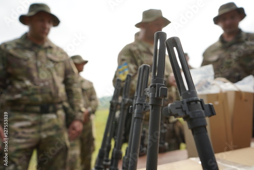 Poltava-Kharkiv region, Ukraine - August 2022: Issuance of American firearms to soldiers of the Ukrainian army and volunteers of the territorial defense. Rifle M14. Lots of firearms.