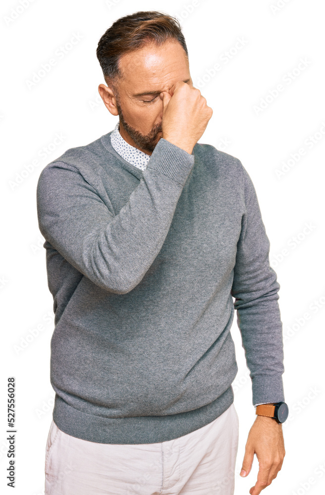 Handsome middle age man wearing business clothes tired rubbing nose and eyes feeling fatigue and headache. stress and frustration concept. Handsome middle age man wearing business clothes tired rubbing nose and eyes feeling fatigue and headache. stress and frustration concept.