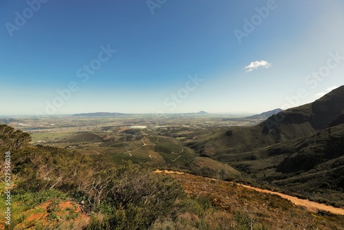 A view from Du Toits Kloof Pass towards Wellington in the distance on a hazy day.