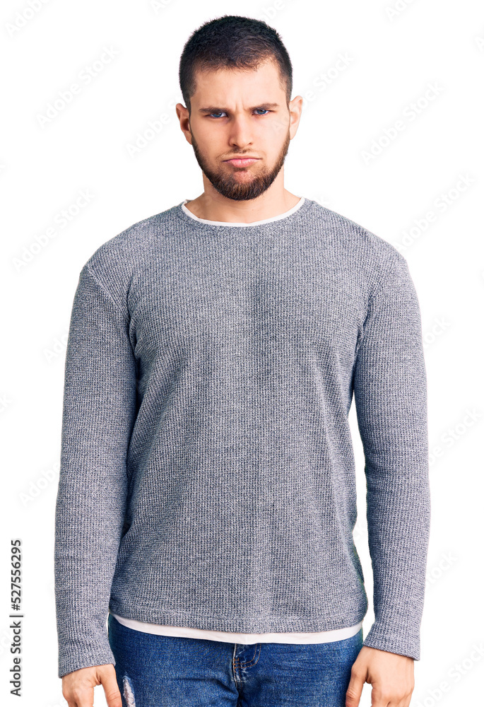 Young handsome man wearing casual sweater depressed and worry for distress, crying angry and afraid. sad expression. Young handsome man wearing casual sweater depressed and worry for distress, crying angry and afraid. sad expression.