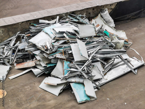 A pile of aluminum scrap. Construction debris piled up. Garbage from non-ferrous metals.