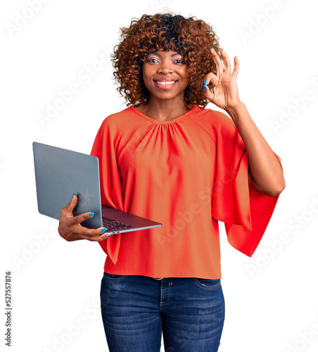 Canvastavla Young african american woman working using computer laptop doing ok sign with fi