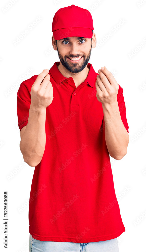 Young handsome man with beard wearing delivery uniform doing money gesture with hands, asking for salary payment, millionaire business Young handsome man with beard wearing delivery uniform doing money gesture with hands, asking for salary payment, millionaire business