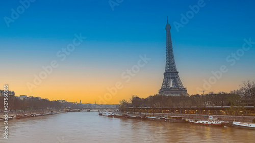 The Eiffel Tower, iconic Paris landmark as autumn trees park as Seine river with sunset sky scene in Paris ,France