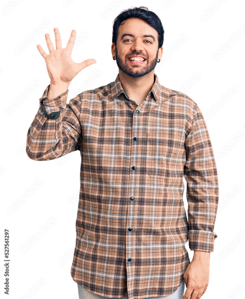 Young hispanic man wearing casual clothes showing and pointing up with fingers number five while smiling confident and happy. Young hispanic man wearing casual clothes showing and pointing up with fingers number five while smiling confident and happy.