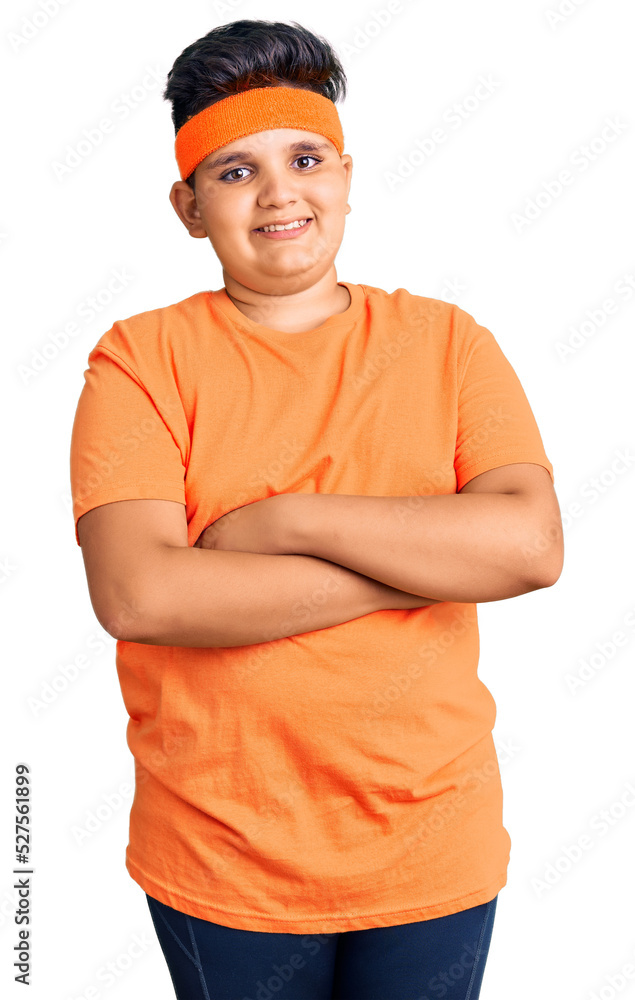 Little boy kid wearing sportswear happy face smiling with crossed arms looking at the camera. positive person. Little boy kid wearing sportswear happy face smiling with crossed arms looking at the camera. positive person.