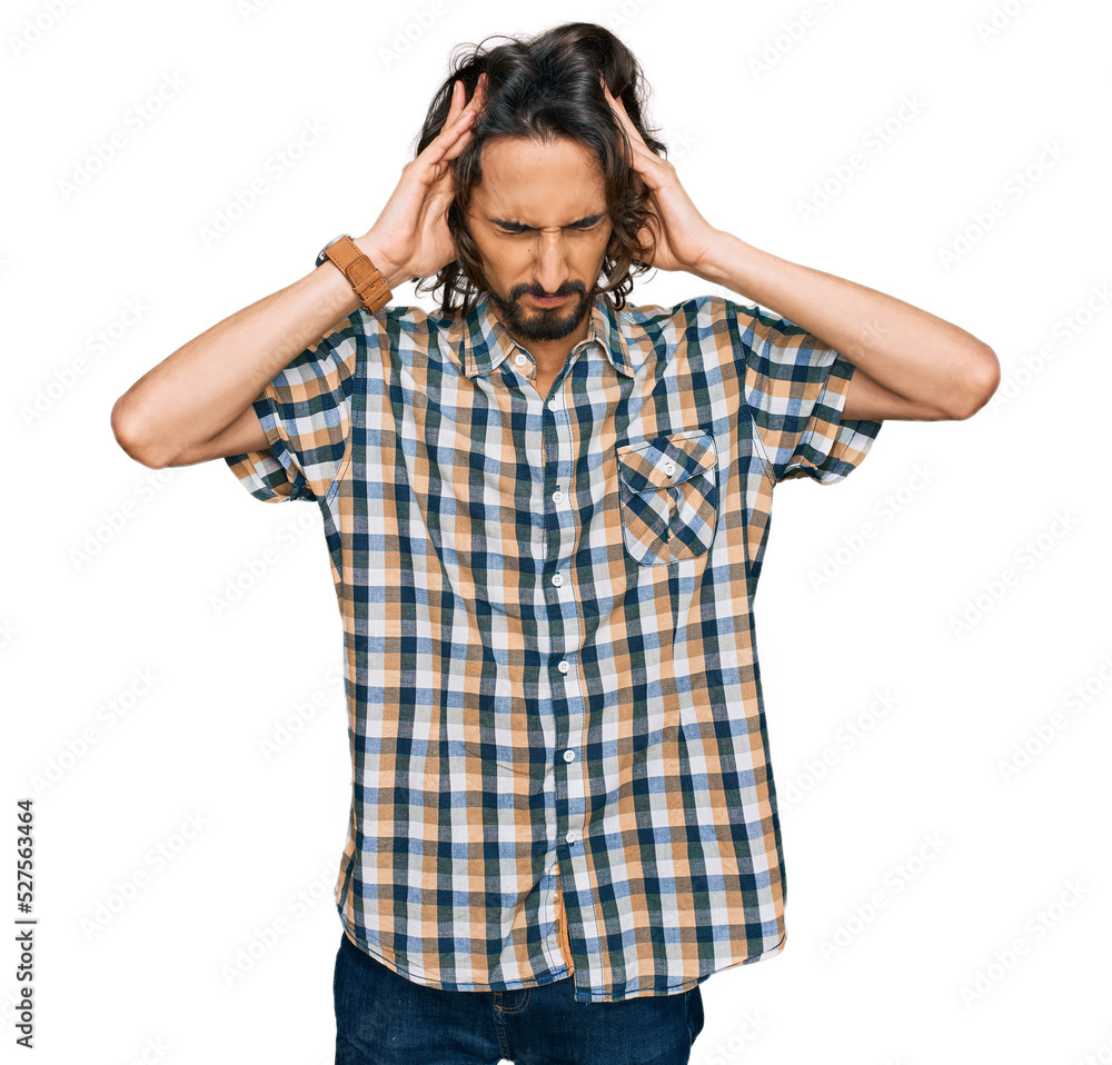 Young hispanic man wearing casual clothes suffering from headache desperate and stressed because pain and migraine. hands on head. Young hispanic man wearing casual clothes suffering from headache desperate and stressed because pain and migraine. hands on head.