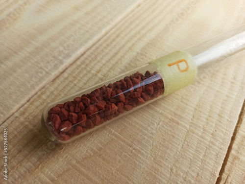 A very important simple inorganic substance - crystalline red phosphorus in a test tube. photo