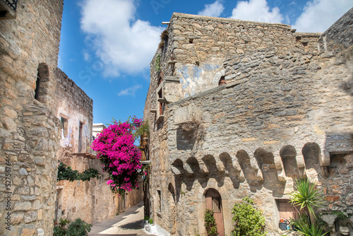 Chios Island, Greece - August 27, 2022. Mesta village street view in Chios Island, Greece. The village of Mesta is the most distant of the medieval villages. photo