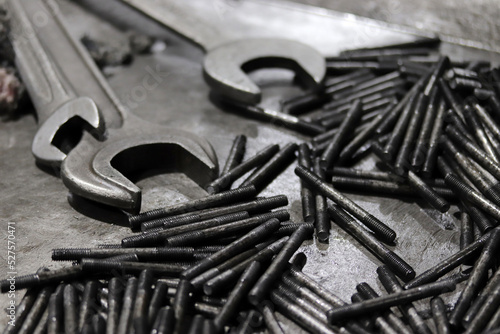 Wrench and screws. Industrial background. photo