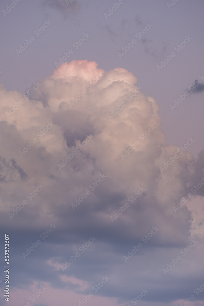 Natural sunny orange and blue sky background with beautiful puffy white cumulus clouds Natural sunny orange and blue sky background with beautiful puffy white cumulus clouds