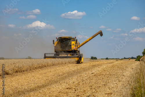 Harvest in Poland  a combine harvester during the harvest season while working on a sunny day  Rozborz  county Podkarpackie  Poland  7th of August  2022