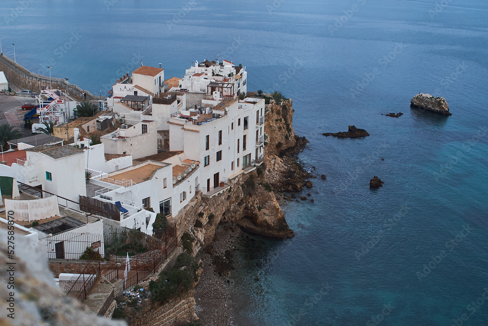 View of Ibiza coastal with the white buildings over cliff