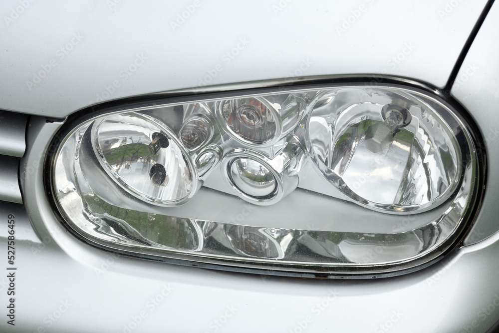 Front headlight close-up of a modern car.