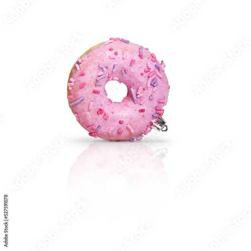 Fresh pink glazed donut as Christmas decorations on white background with reflection.