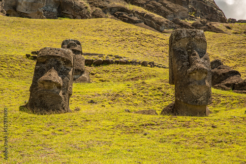 Moai statues in the Rano Raraku Volcano in Easter Island, Rapa Nui National Park, Chile photo