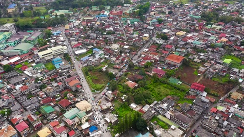 Panorama of Marawi city with residential buildings and mosques on the shore of lake Lanao. Mindanao, Lanao del Sur, Philippines. photo