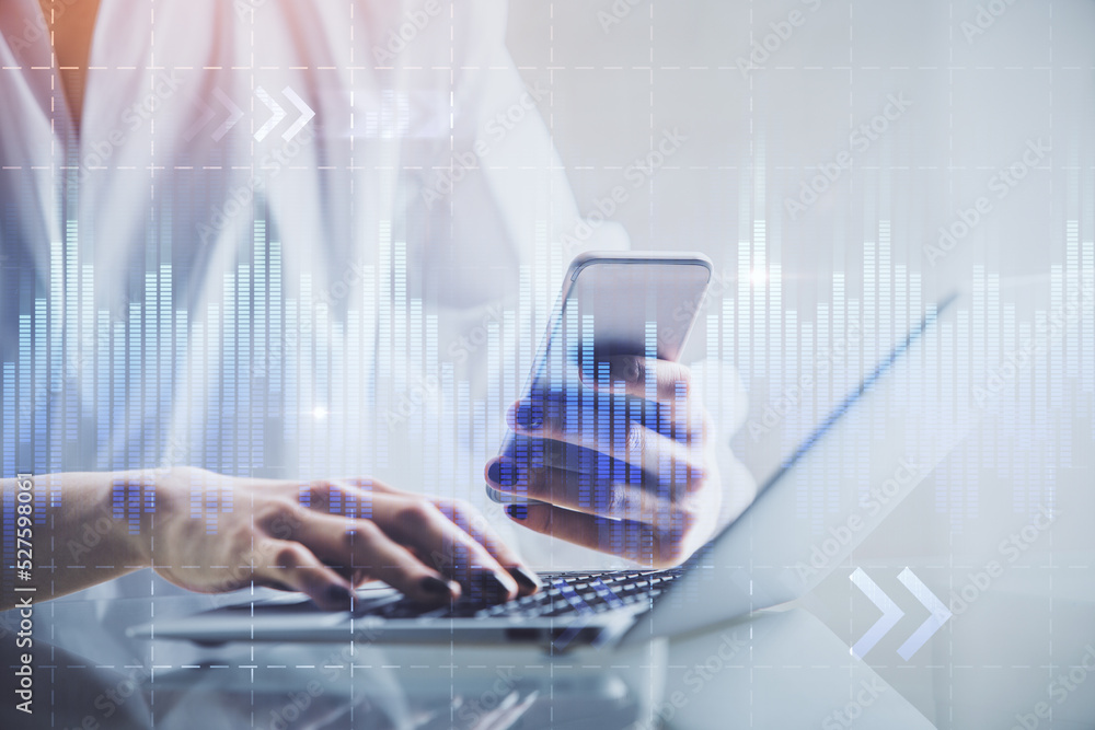 Double exposure of financial graph sketch hologram and woman holding and using a mobile device. Stock exchange concept. Double exposure of financial graph sketch hologram and woman holding and using a mobile device. Stock exchange concept.