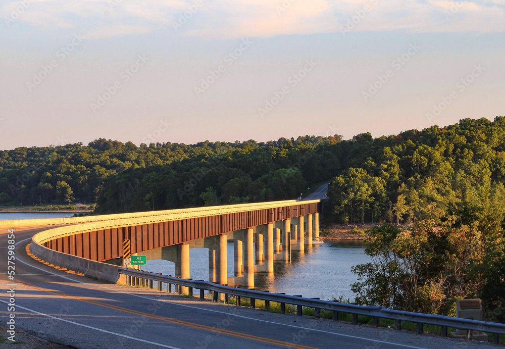 Looking out over Norfork Lake as the evening sun shines on the Hwy. 101 Bridge in Gamaliel, Arkansas