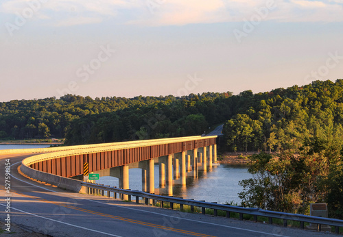 Looking out over Norfork Lake as the evening sun shines on the Hwy. 101 Bridge in Gamaliel, Arkansas