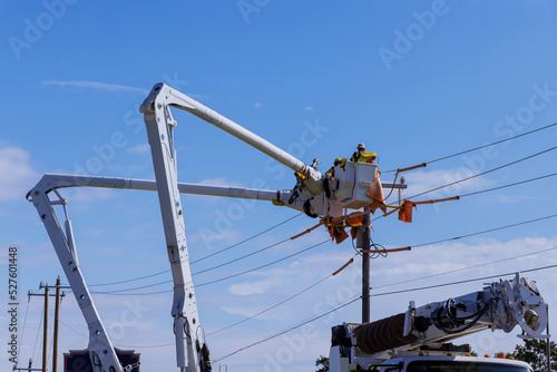 A technician in electrical power pole maintenance industry has been hired to repair the after storm damaged power lines.