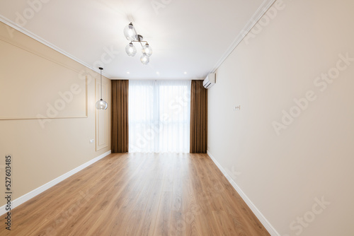 Interior design of a room with light walls and a window. empty and clean