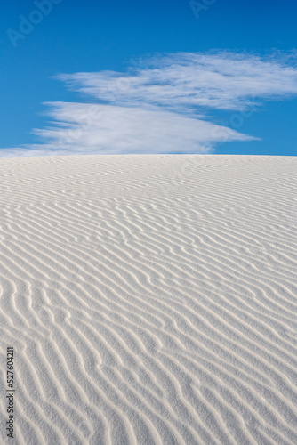 Flat Cloud Crests Over White Sand Dune With Ripple Texture