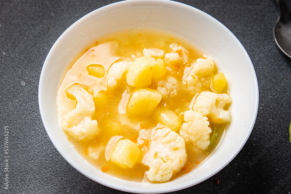 cauliflower soup broth vegetables fresh dish healthy meal food snack diet on the table copy space food background rustic top view keto or paleo diet veggie vegan or vegetarian food cauliflower soup broth vegetables fresh dish healthy meal food snack diet on the table copy space food background rustic top view keto or paleo diet veggie vegan or vegetarian food