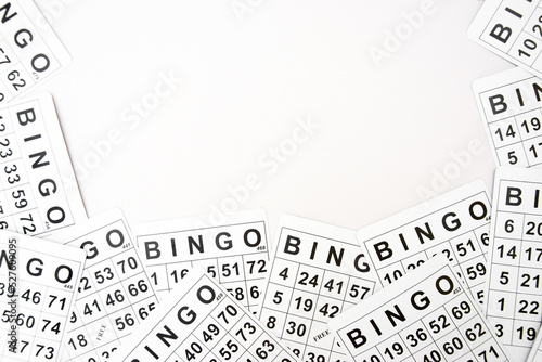 A lot of cards for a board game of bingo or lotto on a light background.