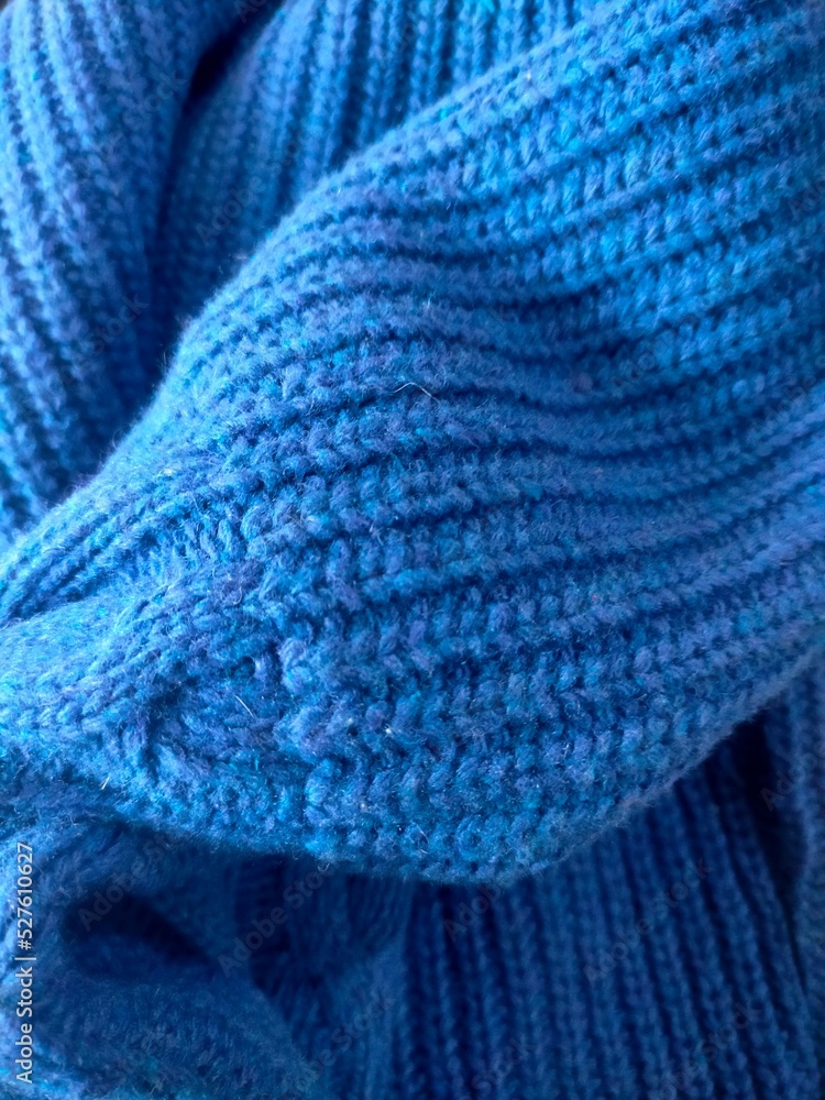Knitting sweater on close up view Knitting sweater on close up view