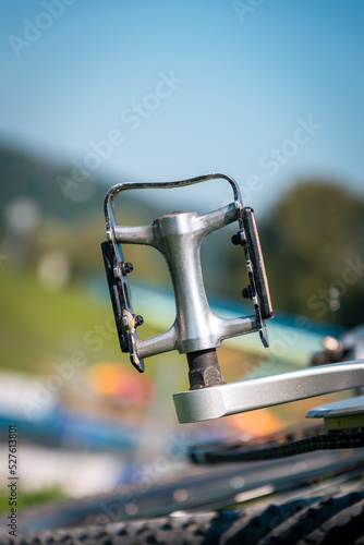 detail of a bicycle pedal with a blurry background photo