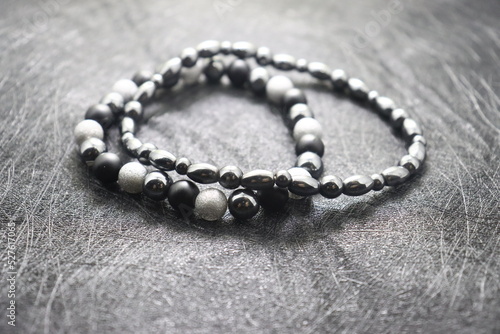 jewelry bracelet black volcanic stone black matte ring made of silver men's women's collection on a black background
