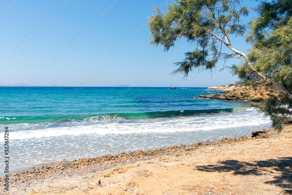 Beach with crystal clear sea water, in Naxos island. Cyclades Greece. Europe Beach with crystal clear sea water, in Naxos island. Cyclades Greece. Europe