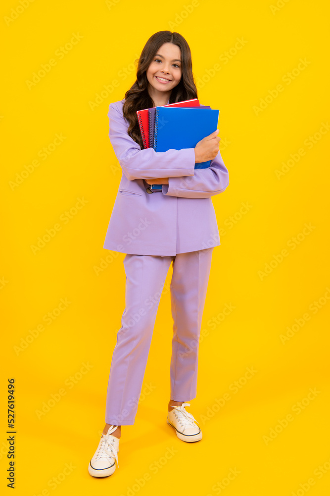 Schoolgirl with copy book posing on isolated background. Literature lesson, grammar school. Intellectual child reader. Schoolgirl with copy book posing on isolated background. Literature lesson, grammar school. Intellectual child reader.