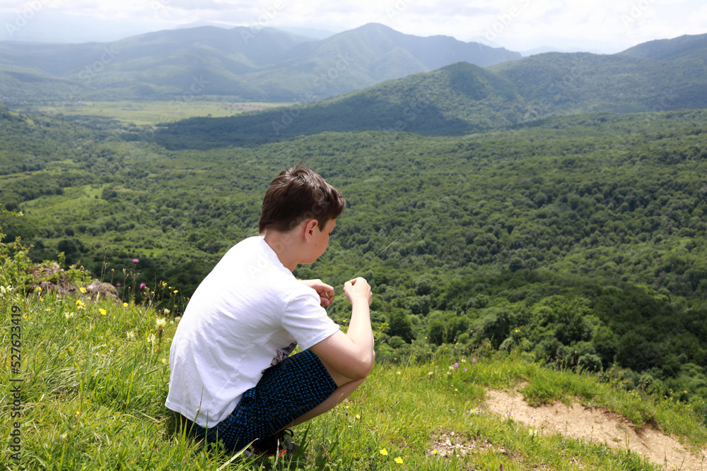 Portrait of boy on Azish-Tau ridge background