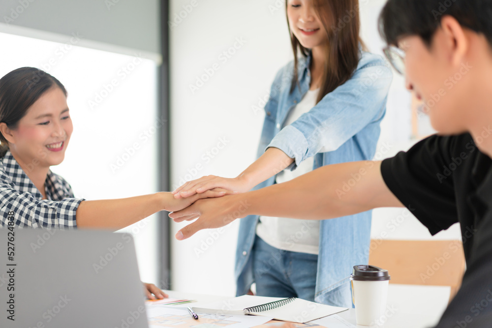 Fototapeta premium Design building concept, Architects team putting hand together to working business of design build